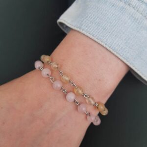 Handmade Love and Light Bracelets featuring Rose Quartz and Citrine beaded bracelets shown worn on wrist.