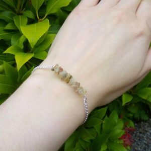 Handmade Golden Quartz chip bead bar bracelet worn on wrist.