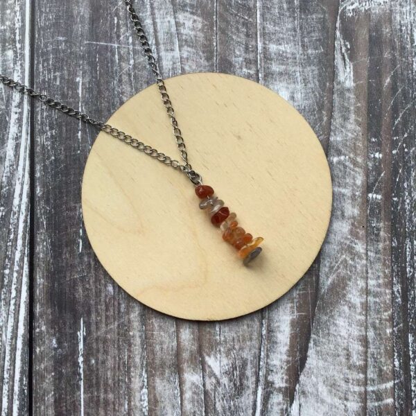 Handmade Carnelian Necklace. Necklace features a row of Carnelian chip beads on stainless steel wire. which is suspended from stainless steel curb chain.