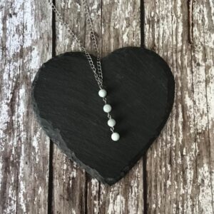 Handmade Aquamarine beaded necklace. Pendant suspended on a stainless steel curb chain.