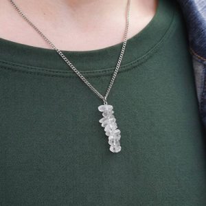 Handmade Crystal Quartz Necklace. Features a row of Crystal Quartz chip beads on a stainless steel wire suspended from a stainless steel chain