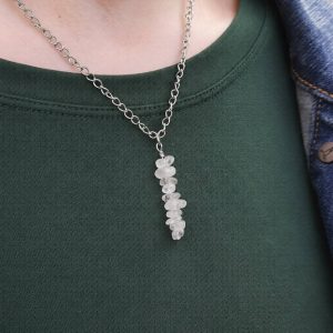 Handmade Crystal Quartz Necklace. Features a row of Crystal Quartz chip beads on a stainless steel wire suspended from a stainless steel chain