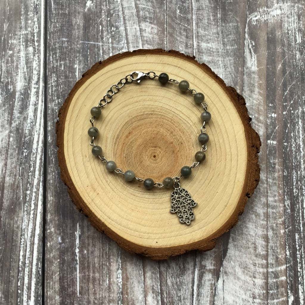 Handmade beaded bracelet featuring round Labradorite gemstones paired with an antique silver hamsa charm